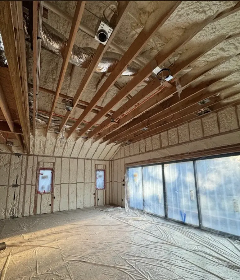 Interior walls and ceiling insulated with spray foam during new construction in Carbondale